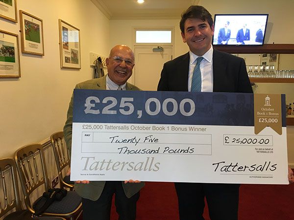 Purchaser Tony Nerses and trainer Hugo Palmer with cheque for Â£25,000